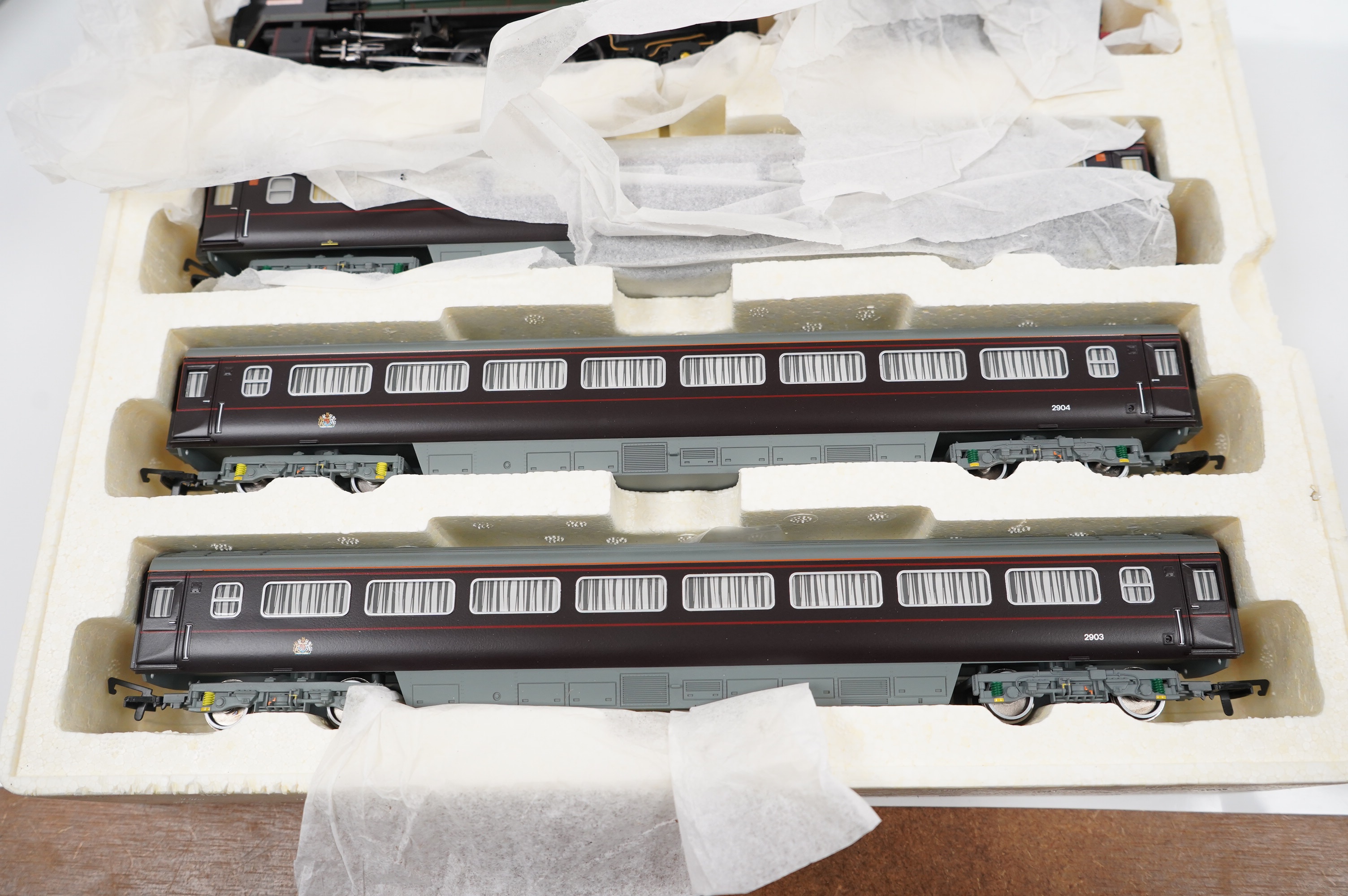 A Hornby Hobbies 00 gauge railway ‘Diamond Jubilee’ train pack, R3094, Queen Elizabeth II Royal Train comprising of a BR Britannia class locomotive and three carriages. Condition - good.